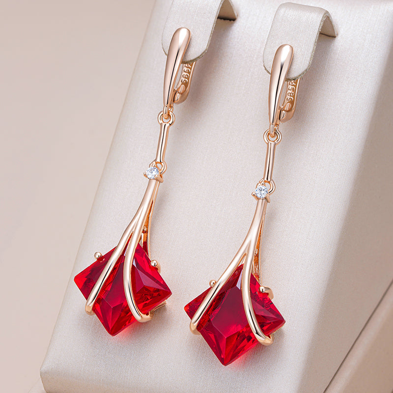 Boucles d'oreilles élégantes et creuses en cristal rouge et or